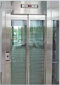 Panoramic landing door with shatterproof glass panels in a stainless-steel frame